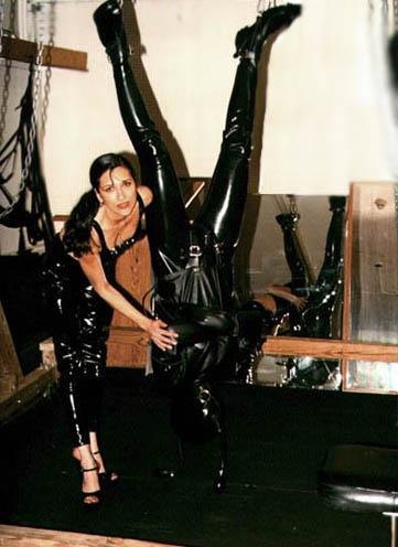 Mistress Sharina with her fetish pet. Rubberized in latex bondage and suspended in total animation!