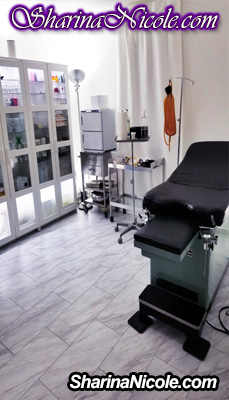 fully equipped medical room with ob-gyn table and assorted medical tools and devices